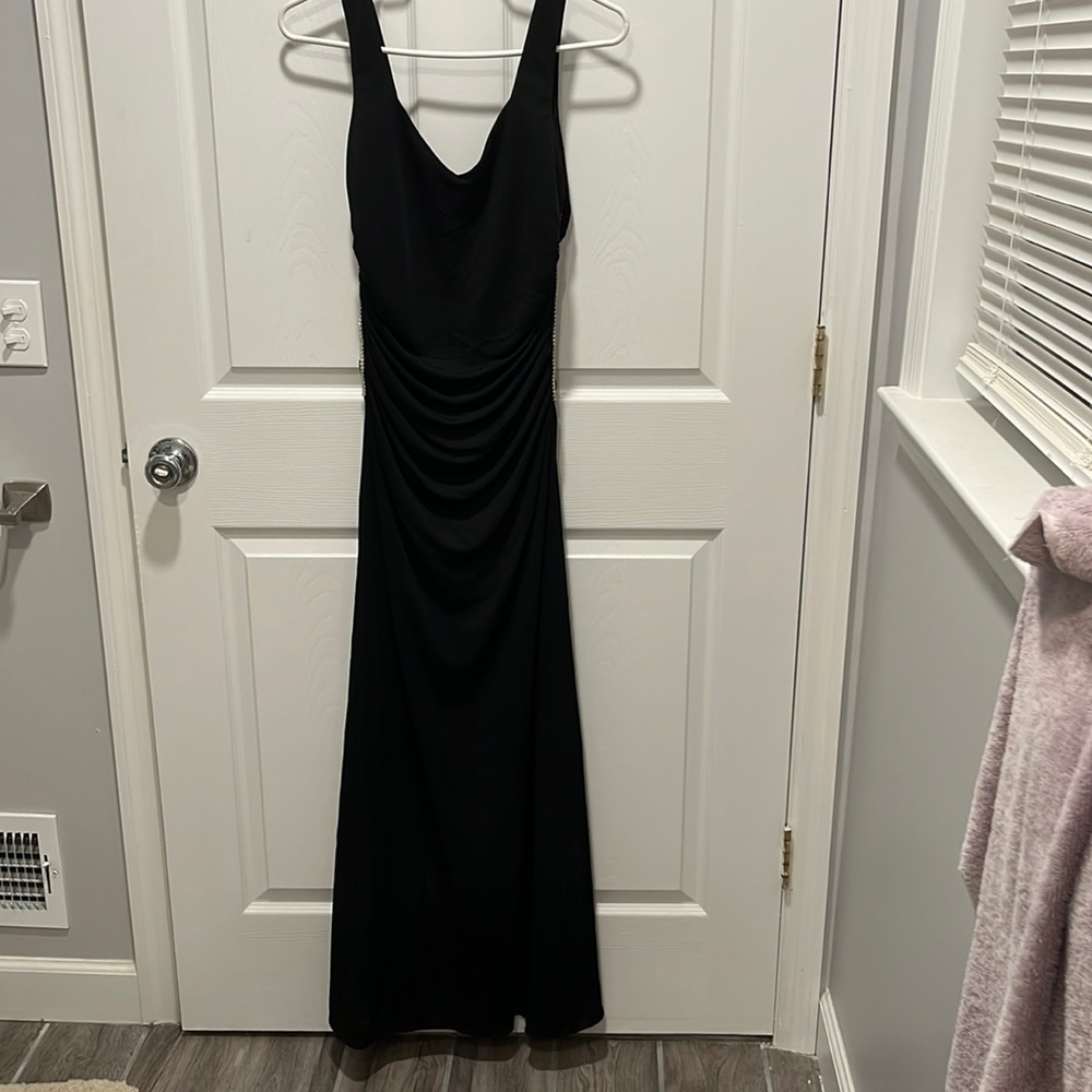 Gorgeous black gown with sequin detail!